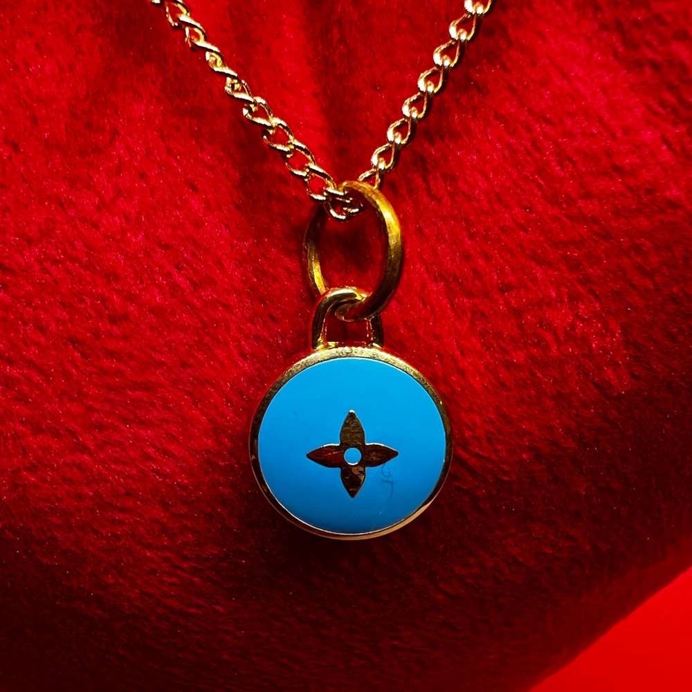 Authentic Louis Vuitton Gold and Blue Charm